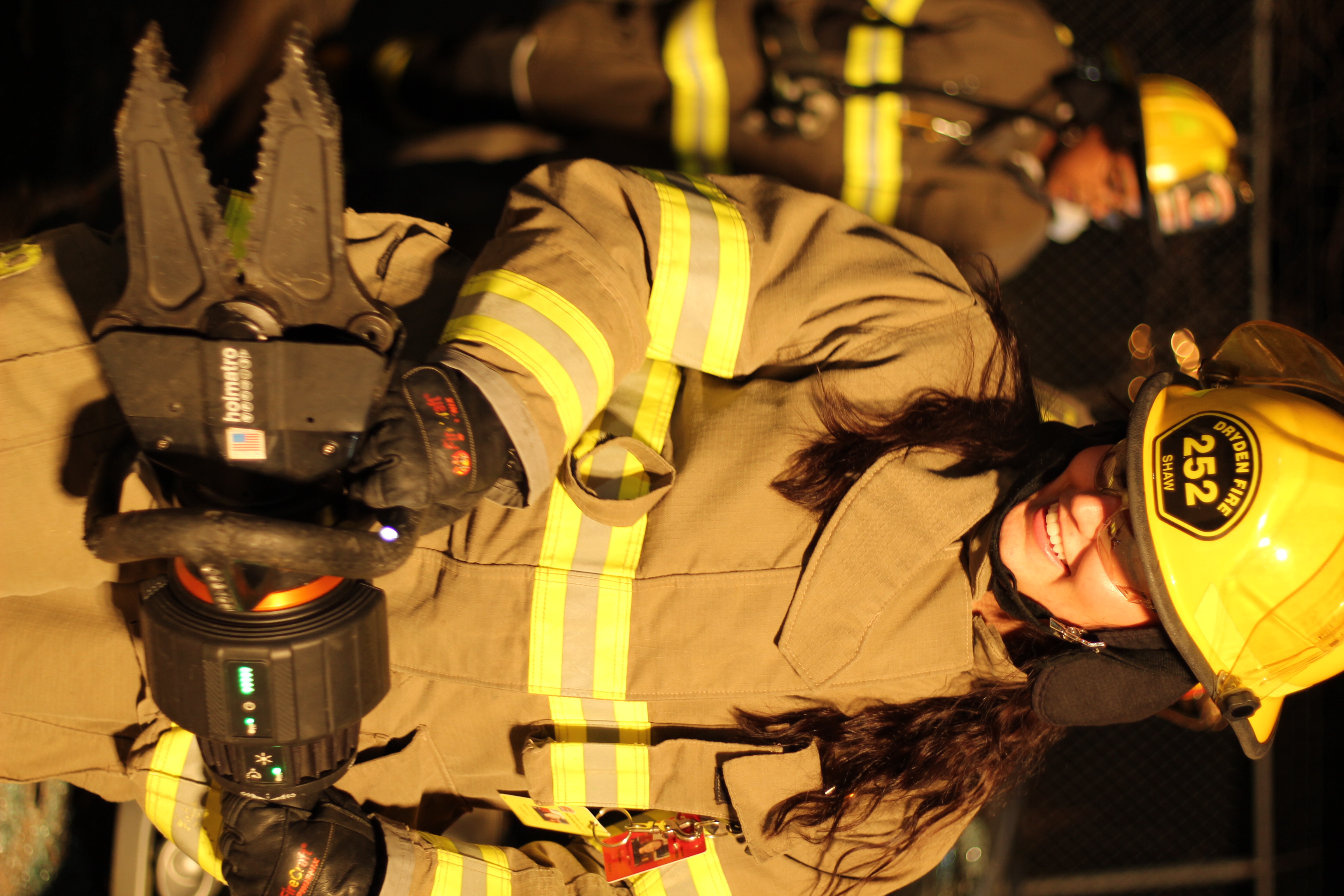 Firefighter holding hydraulic spreaders