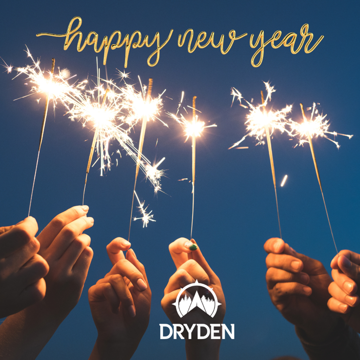 Close up of 6 hands holding sparklers with the banner that says Happy New Year